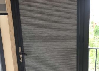 Perfect fit blackout pleated blinds fitted on a bifold door in Exmouth.